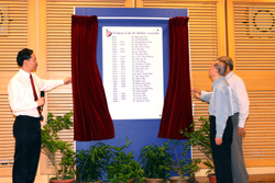 Mr Tan Boon Chiang (Past President, 1961-63) unveiling the plaque with Dr Ang Peng Tiam and Mr Tan Wah Thong (hidden) looking on