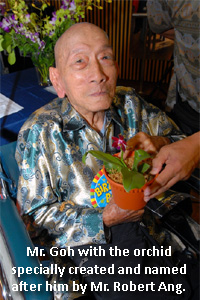 Mr Goh with the orchid specially created and named after him.