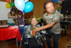 Robert Ang presenting the Phalaenopsis Goh Chin Chye to Mr. Goh