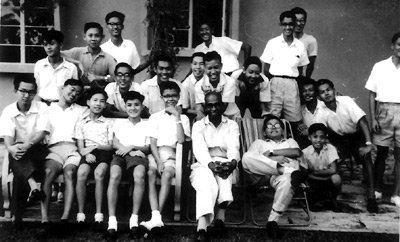 This photograph of the young Mr Lau (relaxing on deck chair with arms folded) and his students speaks volumes of teacher-student relationship