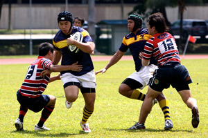 Blandon Tan breaks a tackle