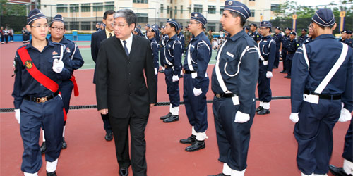 Mr Ng Eng Chin inspects the parade at ACS (Barker Road)