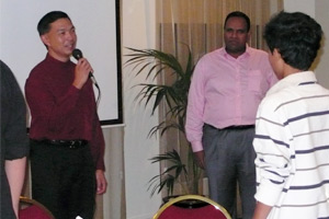 Tan See Keng leading us in the singing of the School Anthem. Suresh John, the organiser of the celebration, is on his left